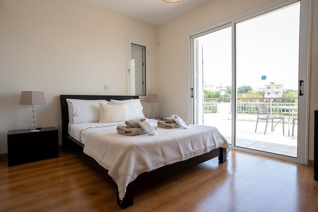 Bedroom with balcony view