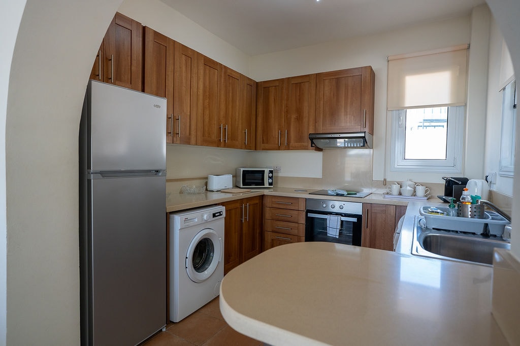 Modern kitchen with wood cabinets and appliances
