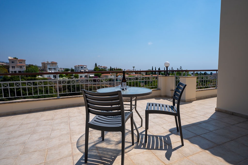 Rooftop terrace with table and chairs and views